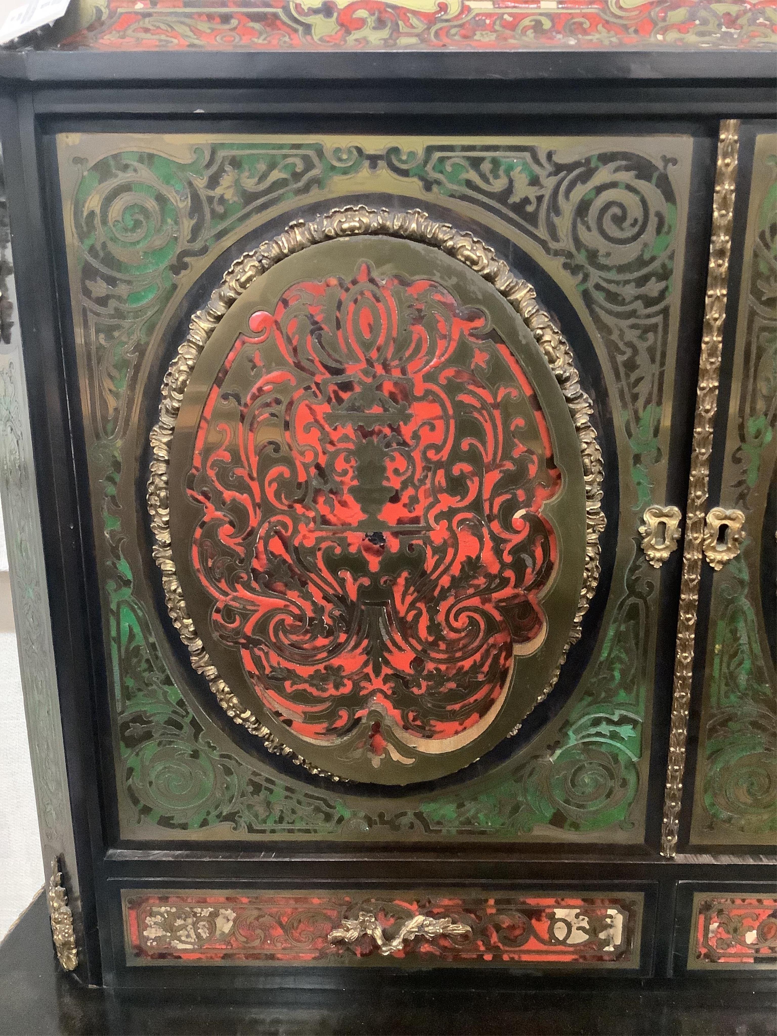 A 19th century French ebonized Boulle bonheur du jour, width 78cm, depth 54cm, height 128cm. Condition - fair to good, some minor losses and raised cut brass work.